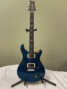 Taylor 214 CE natural finish in dark blue color