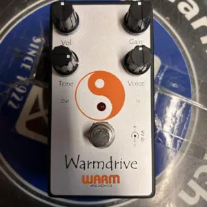 A Warm Audio Warmdrive pedal with a yin - yang symbol on it.