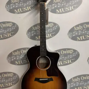 A taylor taylor acoustic guitar with a sunburst finish.
