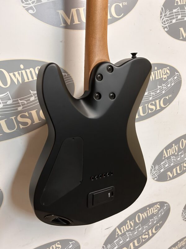 A black electric guitar with a wooden body.