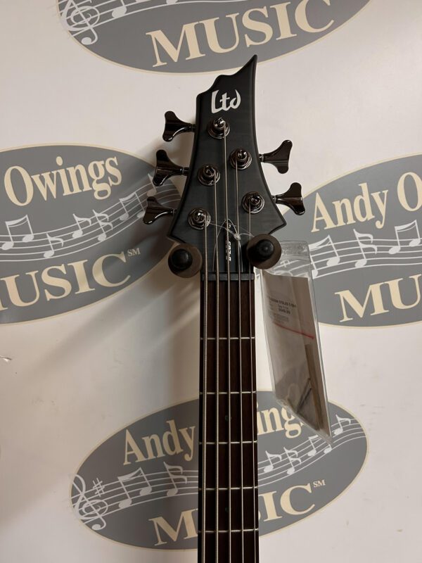 A black ESP LTD B205SM STBLKS 5-String Bass Black Spaltic Maple with a logo on it.