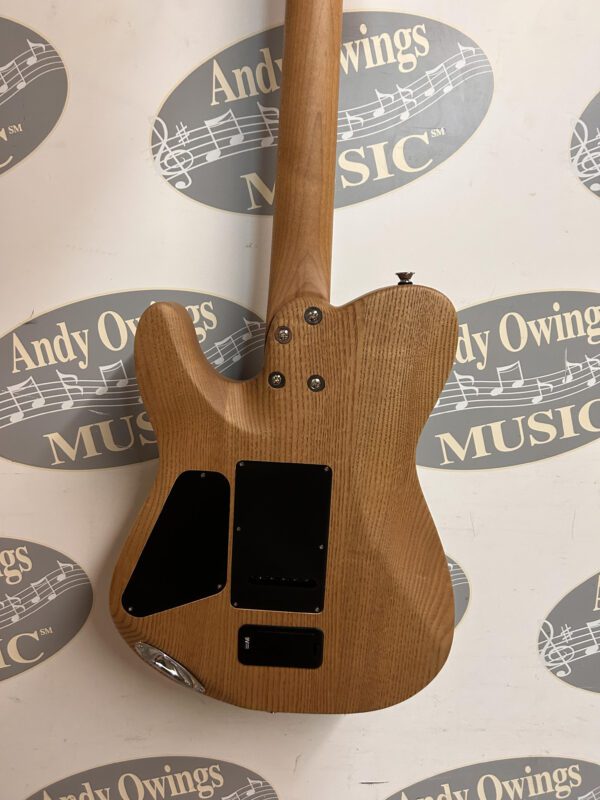 A wooden guitar with a logo on it.