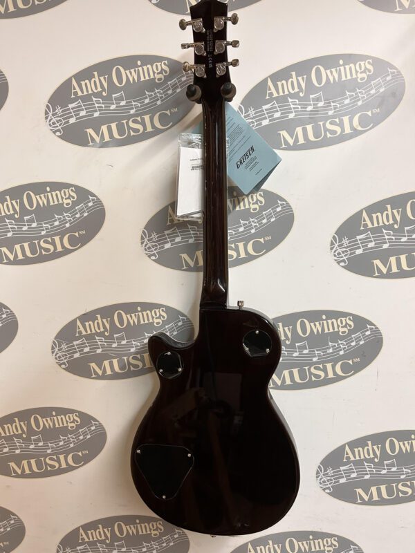 A black guitar with a logo on it.