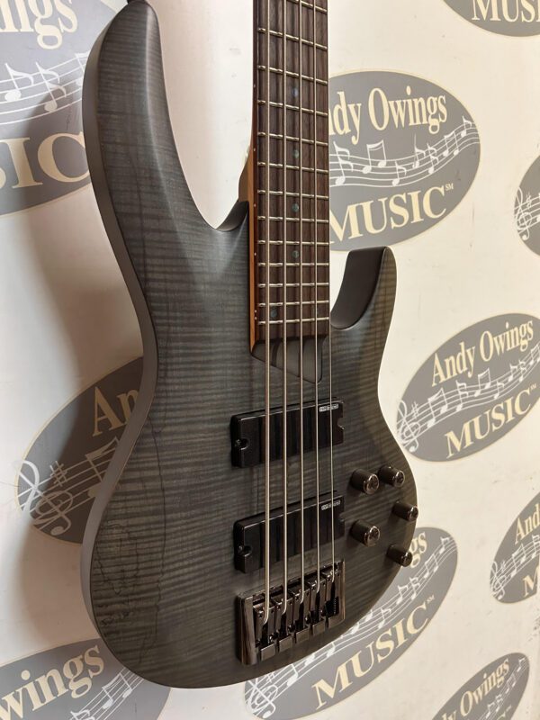 A ESP LTD B205SM STBLKS 5-String Bass Black Spaltic Maple with a logo on it.